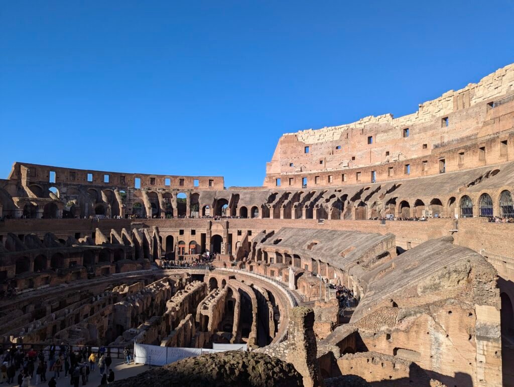 nterior view of the Colosseum in Rome, showing the ancient arena floor and underground chambers